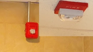 System Sensor SPSRL and a Wheelock RSS-24MCW-FR in the mens bathroom at a movie theater