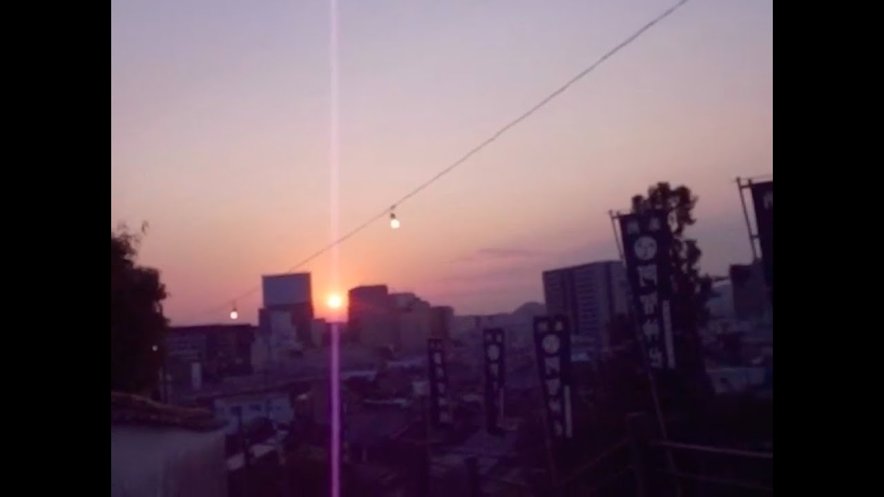 At dusk, walking the shinto shrine in May, along the path