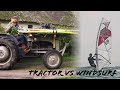 Man uses tractor to go windsurfing