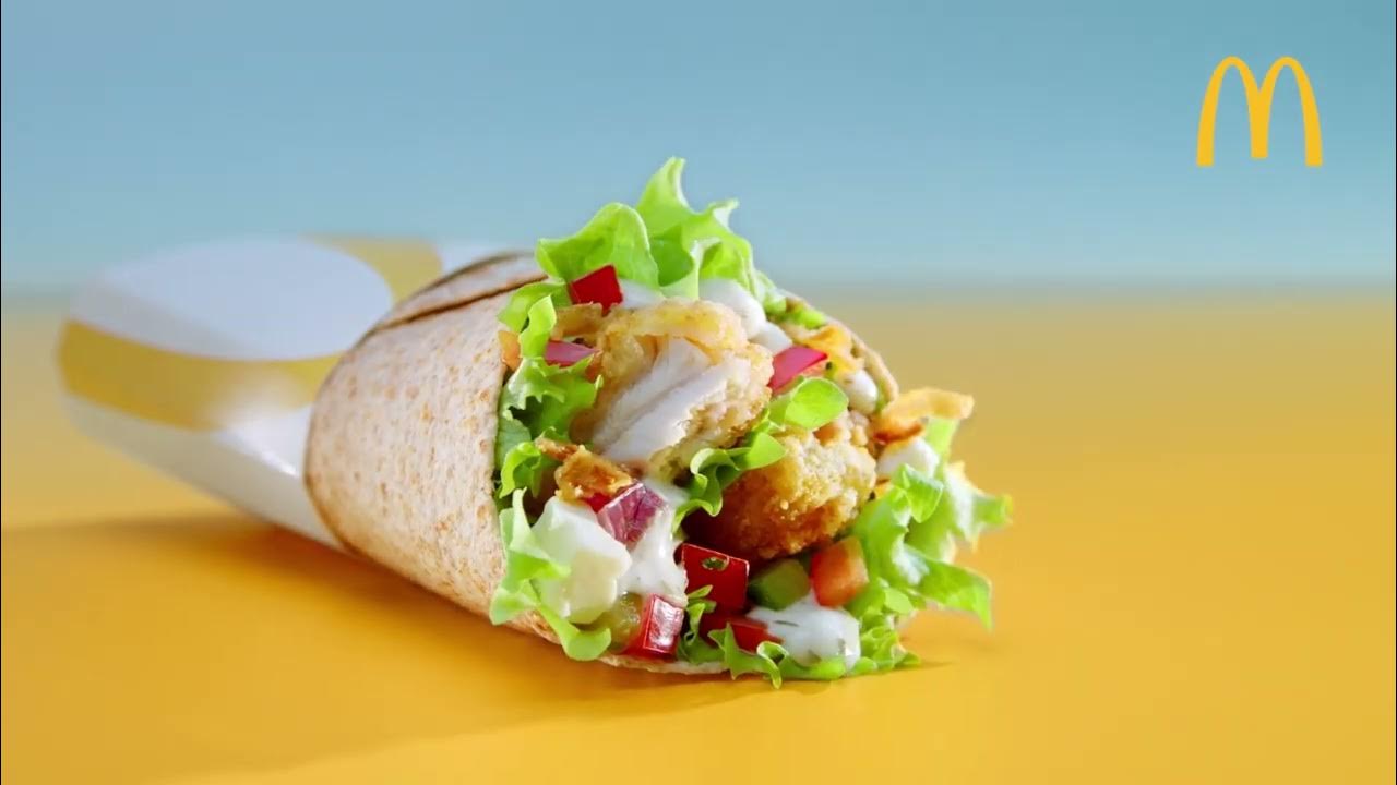 Nieuw: De McWrap Greek | McDonald's - Witte kaasblokjes, Griekse salsa, frisse yoghurtsaus en malse Chicken Tenders in een krokant laagje. Probeer 'm nu!