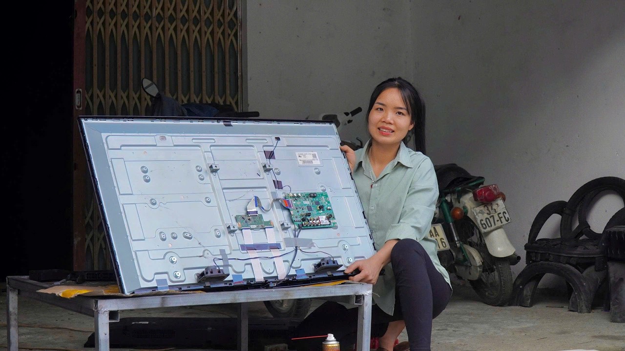 Can the girl fix the giant TV? She's upset because her phone is broken.
