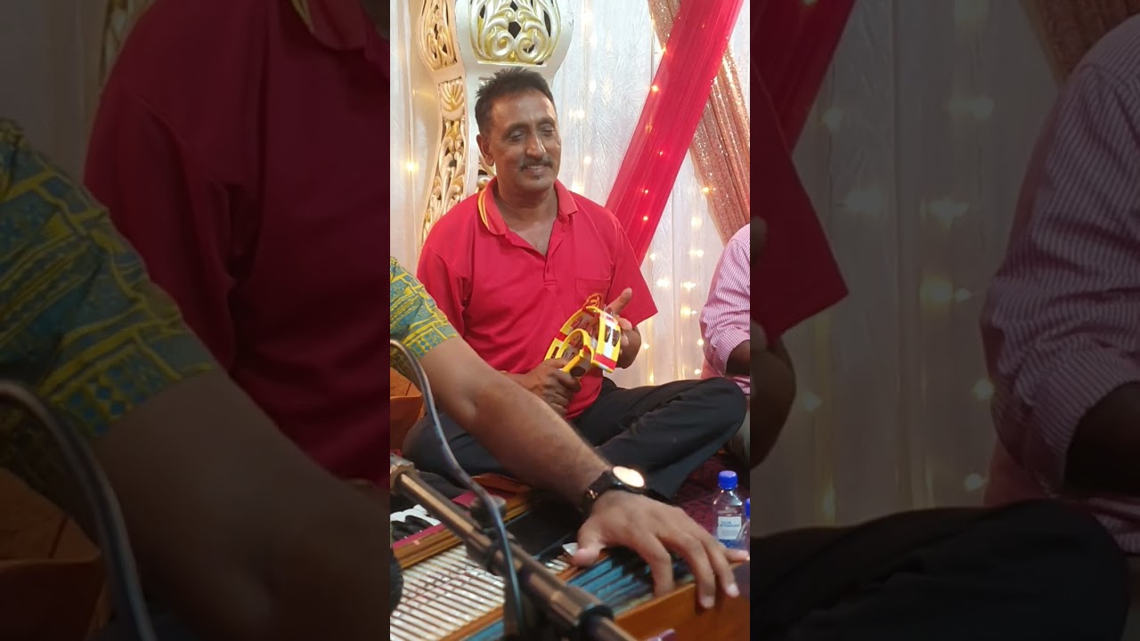 Fiji tambura bhajan by Rajendra ( tiggi ) & dholak by Binesh ( johnny ) .. recorded by Arjesh Sami .