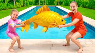 Maya and Mom Play with a Big Yellow Fish at the Swimming Pool