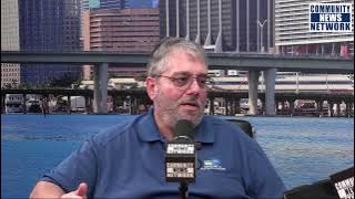 Michael Miller talks with Frank Calderon of Miami Dade Solid Waste Department
