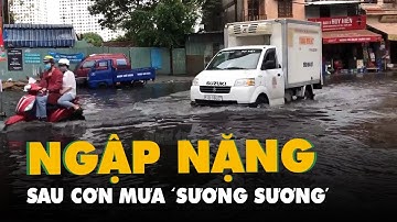 Cơn mưa lướt qua, đường Nguyễn Hữu Cảnh ngập lênh láng