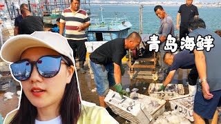 To eat seafood in Qingdao, go directly to the dock to buy it, and process it at the side of the road