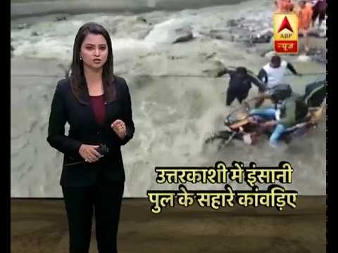 Human Chain To Help People Cross Swollen River After Cloud Burst In Uttarakhand
