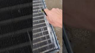 Plastic Coil Comb being used to fix ac fins