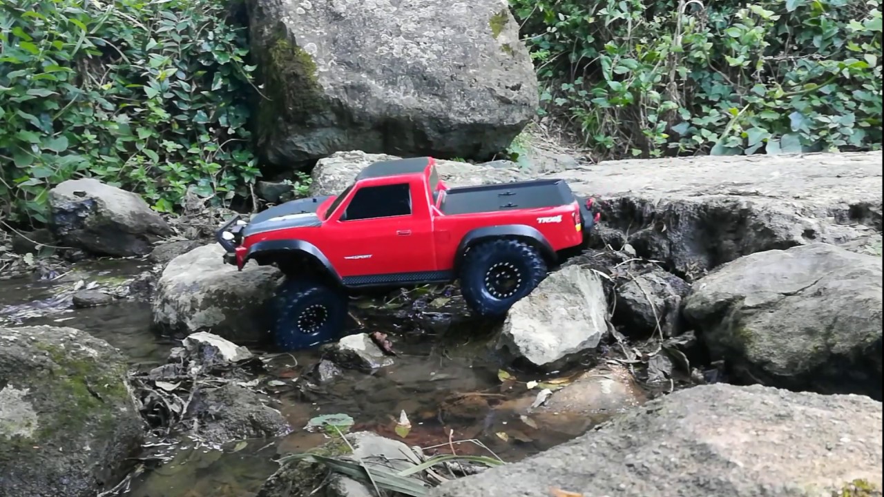 Traxxas trx4 Sport New tires Proline Flat Iron on wet rock