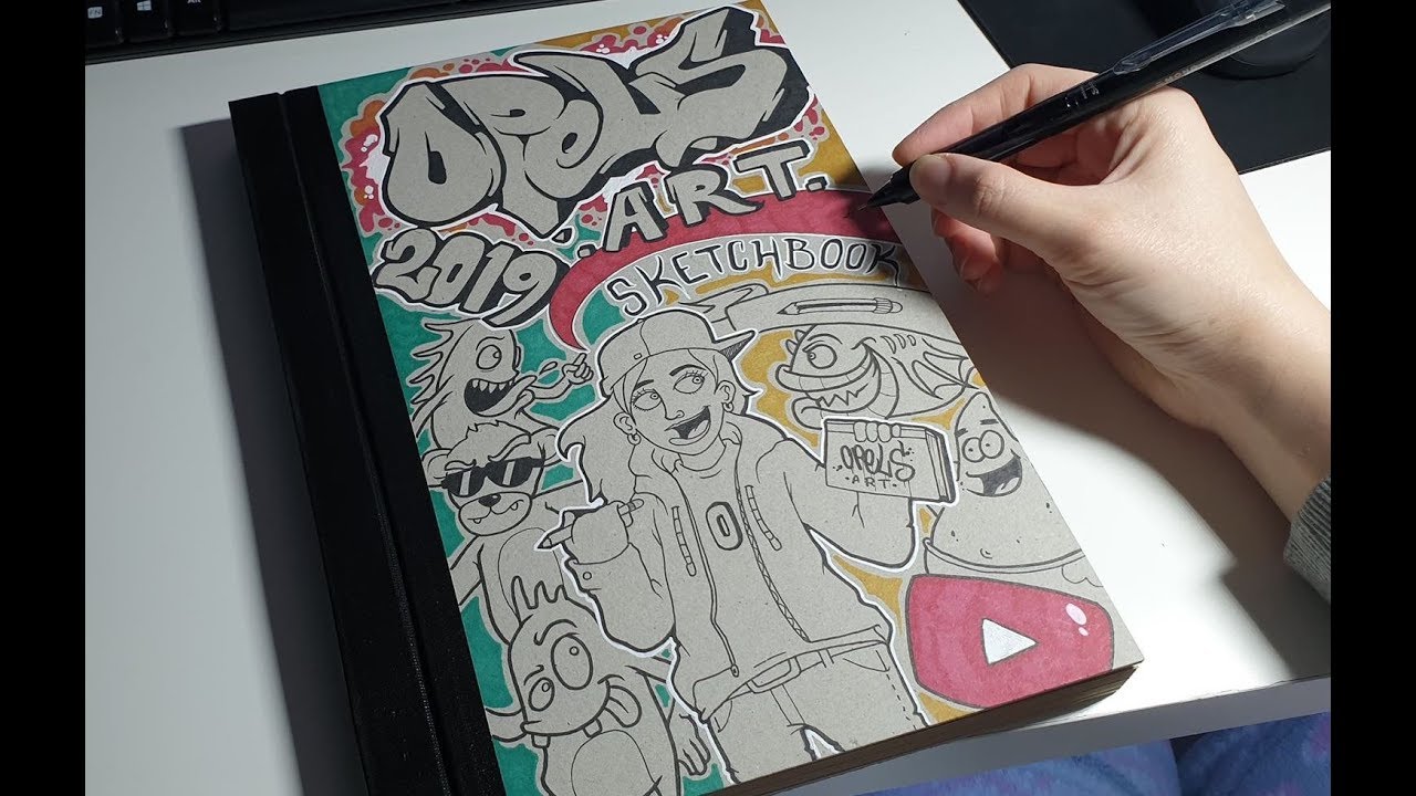 my sketchbook cover! does't look the best since i made it a while