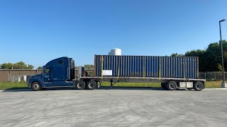Trucking , How to secure a container to a flatbed trailer .