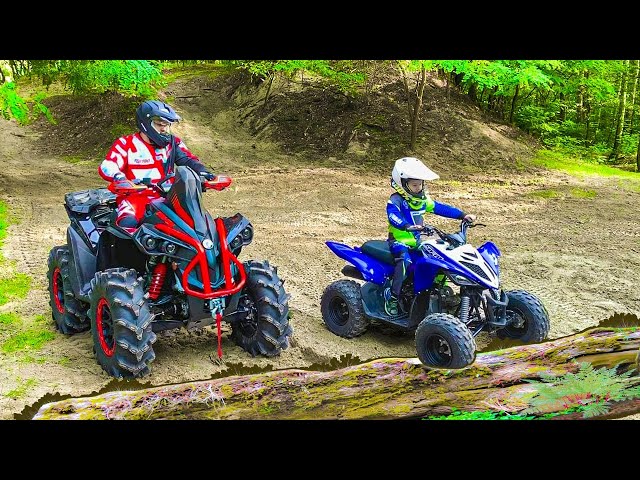 Den and Dad ride on Quad Bikes in the forest Family Fun class=