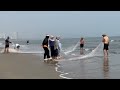 Fishermen Pulling Nets on the Shore 🌊 Traditional Beach Fishing Scene at Sunrise with Ocean Waves