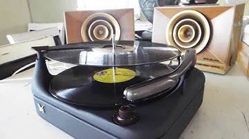 Voice of Music 3 speed automatic record changer playing a couple LP