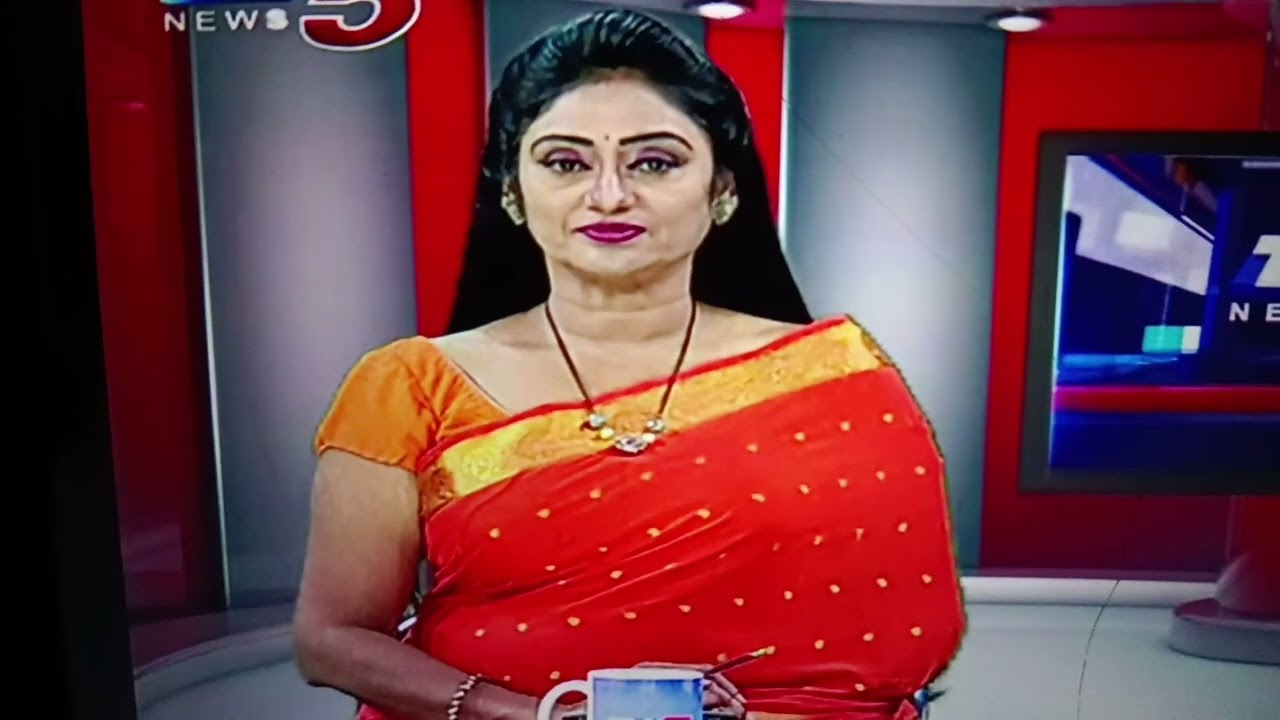 Beautiful Newsreader Kalyani in Orange Saree 