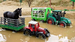 Toy tractors carry animals across puddles to the farm