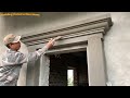 Construction and decoration workers professional window frames using sand and cement bricks