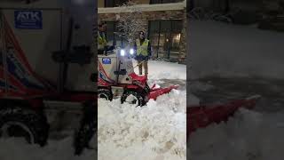 Plowing parking lots after a storm