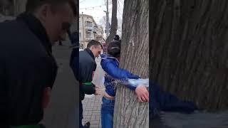 Extrajudicial. watch how policeman deal with their own civilian. she tied with a tree.
