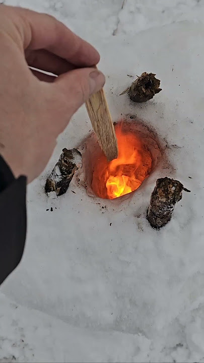 Experimenting with building a rocket stove out of snow 🔥