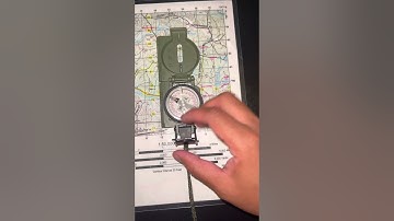 Orient a map using lensatic compass