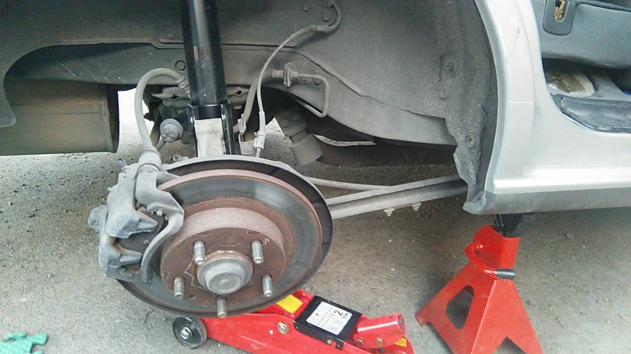 Replacing Rear Struts on a 98 Mazda 626 GF 2L Part 4 Replacing Rear Struts on a 98 Mazda 626 GF 2L Part 4