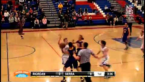 Archbishop Riordan's #0 Max Randall drives the bas...