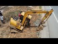 Excavator stuck in mud and the other excavator aid is rescuing - Excavator stuck in deep mud