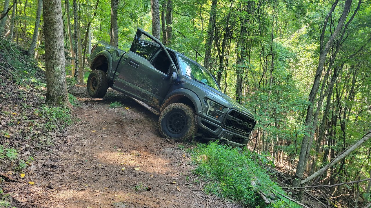 WINCHING OUT A FORD RAPTOR ON A ATV TRAIL - YouTube