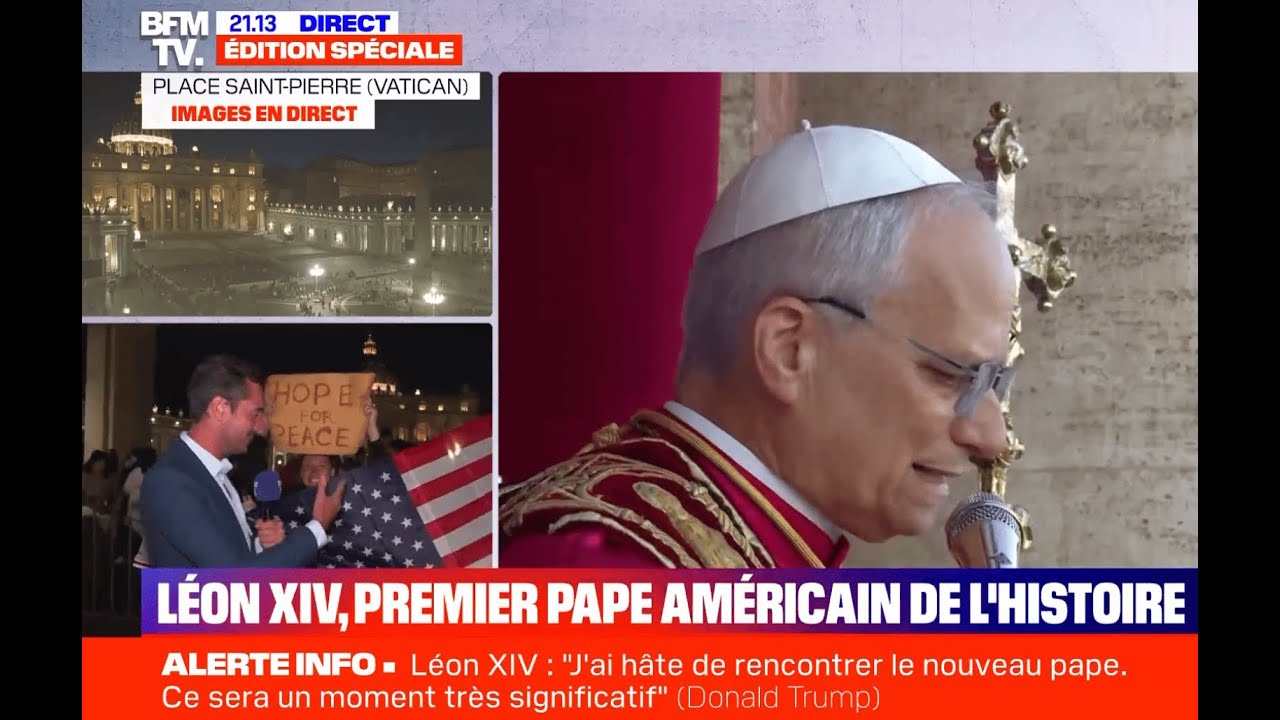 Yona Tukuser holds a "HOPE FOR PEACE" sign in St. Peter's Square at the Vatican during the Conclave