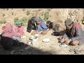 Cooking food in open place and eating food with their family