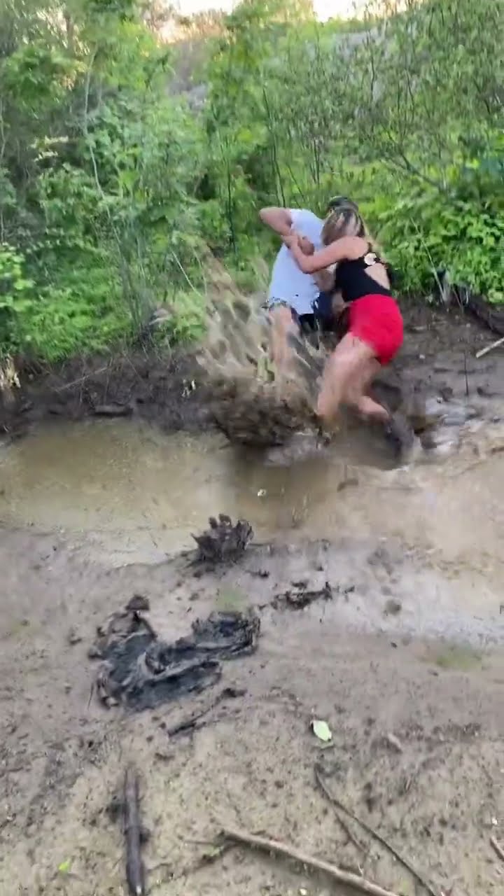 Jump Across Muddy Puddle Ends in a Filthy Fall || ViralHog