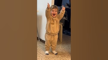 Toddler figures out how to give a thumbs up #shorts