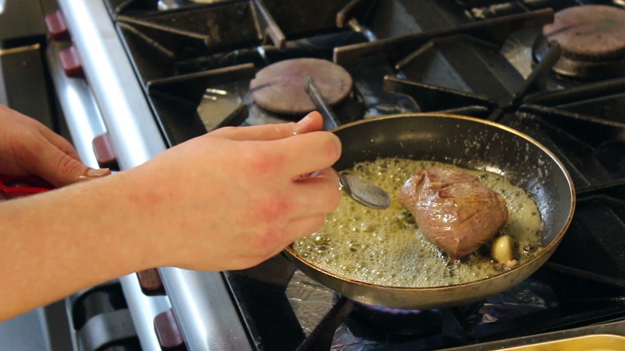Our chef Caer cooking the lamb rump for our 22 At Home