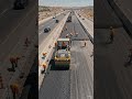 Road roller pressing road workers 202605230856