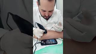 Doctor Gives An Injection Under Ultrasound Control