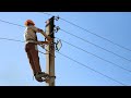 The process of pulling electrical wires on wood.