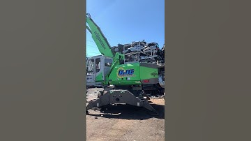 Stacks of crushed cars at the scrap yard