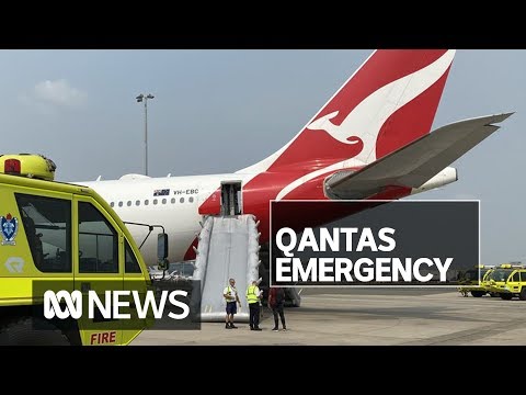 Qantas passengers use emergency slides to evacuate plane at Sydney Airport | ABC News