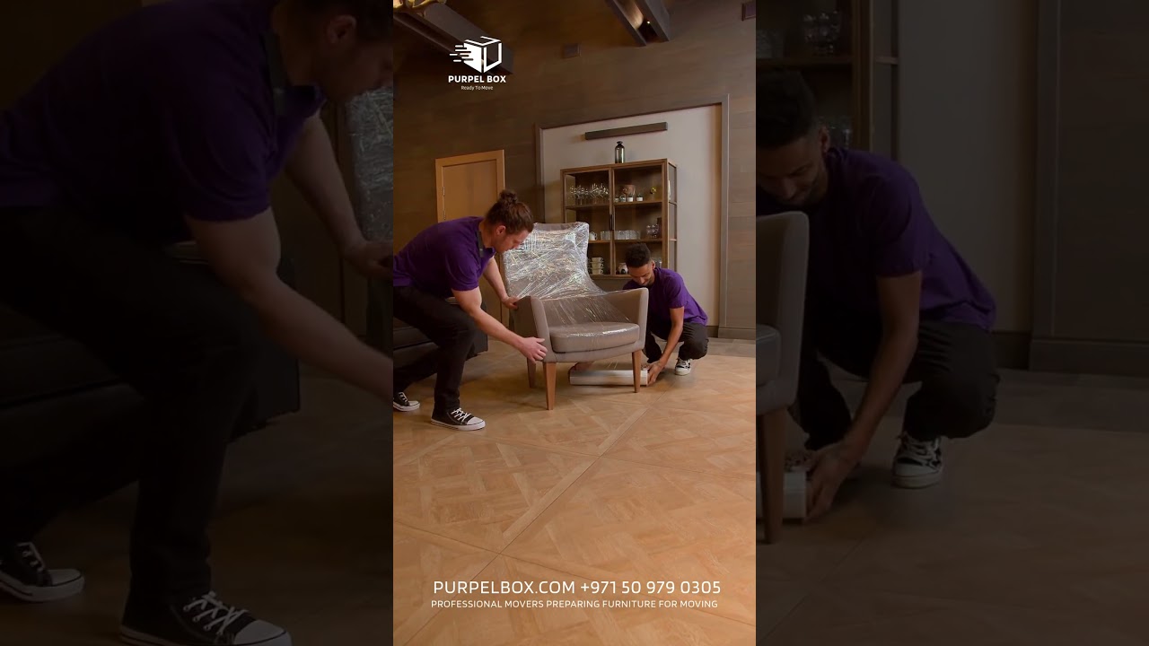 Professional Movers Preparing Furniture for Moving 