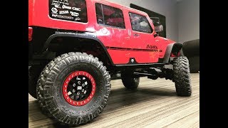 Upgrading the Axial SCX10-ii Jeep Wrangler JK CRC RTR with a set of Vanquish Products Poison Spyder Brawler Rockers. These 