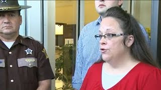 Defiant Kentucky clerk returns to work