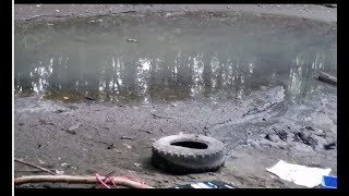 Pulling a tire out of the shoreline at Roxboro Island PART 2