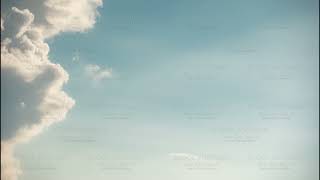 Close-up Fluffy White Clouds Moving Fast Changing to Clear Sky in Time-lapse.