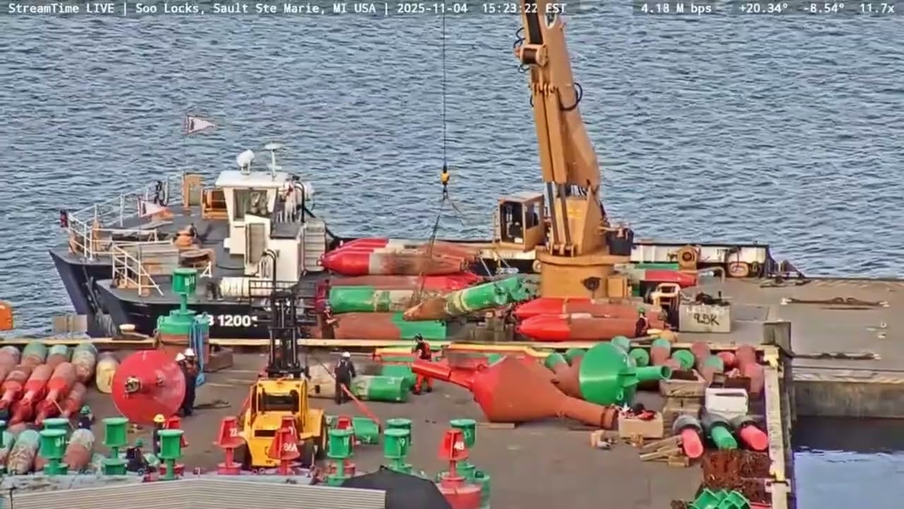 USCGC Bristol Bay with its barge loading up winter buoys, at the Soo locks on Nov 4th, 2025