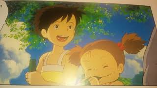 Satsuki And Mei Are Eating A Vegetable In The Garden.