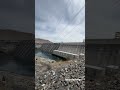 Grand Coulee Dam is a massive concrete gravity and hydroelectric dam on the Columbia River in Wa.