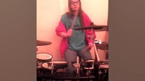 Jennifer Brock playing drums at church