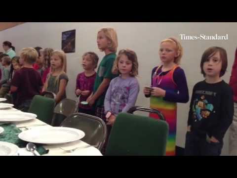 Redwood Coast Montessori students and staff welcome and honor veterans during a luncheon for them at