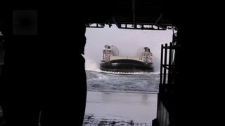 U.S. Navy's LCAC Hovercraft Docking Inside A Ship